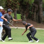 ababa reatcs after he misses putt in hole 13 while his team mate balasabas join him