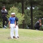 north captain artemio murakami given advise to his player lam before he putt his berdie putt in hole 10