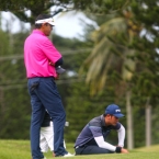 quiban study his line in hole 14 while rhounimi watching in