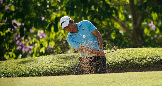 Clyde Mondilla blasts off the greenside bunker but fails to save par for his only bogey in the first 36 holes.