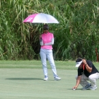 sinfuego aligned his ball while l.tabuena looking in hole 7