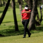 alido check his clubs after his pitchin in hole 8