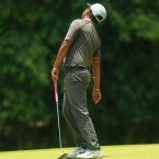 ababa twisting around after a reaction in his miss putt in 16