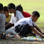 kids are preparing a golf ball for an earning for their school
