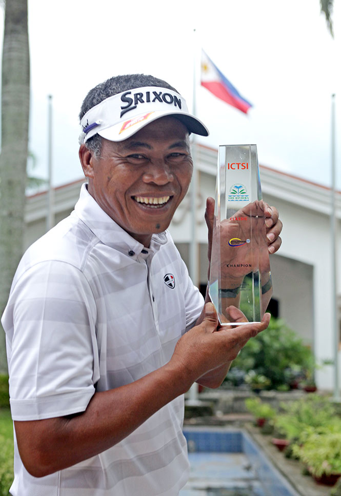 Elmer Salvador beams as he holds his trophy after beating Miguel Tabuena, Tony Lascuna and Rufino Bayron to retain the ICTSI Riviera Classic crown.