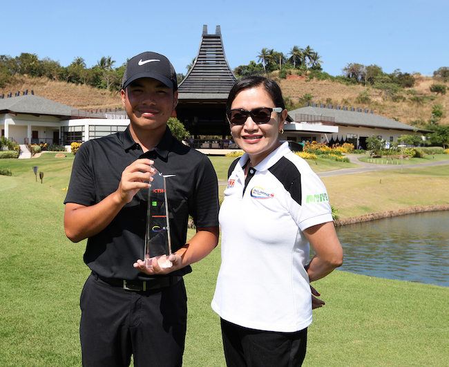 Miguel Tabuena holds his trophy as he poses with ICTSI Public Relations head Narlene Soriano after claiming the ICTSI Anvaya Cove Invitational crown yesterday.