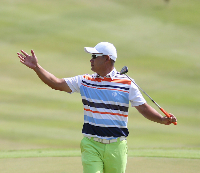 Angelo Que reacts after scoring an eagle on No. 2