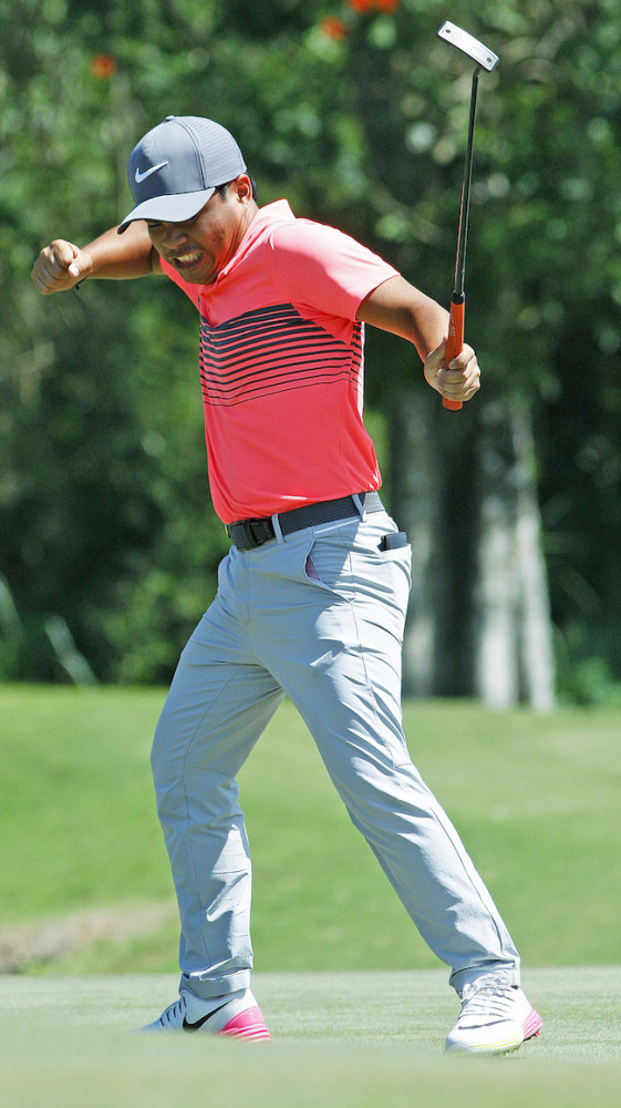Miguel Tabuena reacts after drilling in an eagle on No. 8 